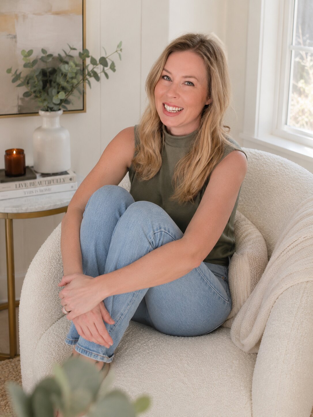 Olivia Radcliffe sitting in a cozy white chair